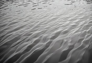 Black and white sea waves close up with reflecting sun rays