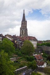 Fototapeta premium Cathedral of Bern against the background of the cloudy sky. Switzerland