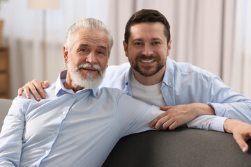 Happy son and his dad at home