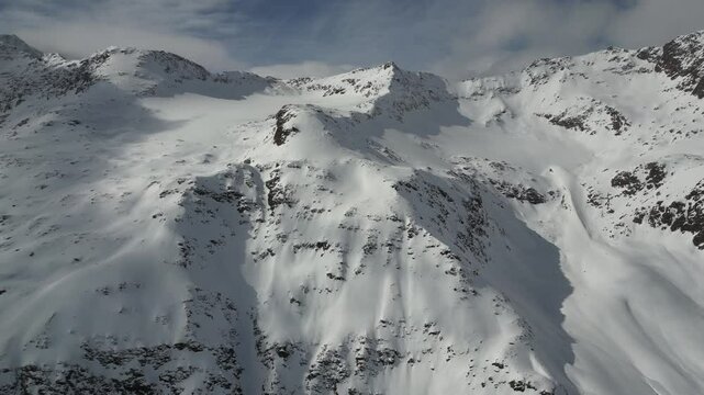 Drone of snow-covered mountains landscape in Obergurgl village in the Otztal Alps in Tyrol, Austria