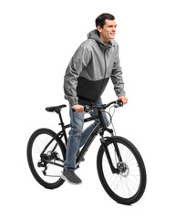 Obraz premium Smiling man riding bicycle on white background