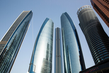 Shot of towering city skyscrapers clustered together in the evening