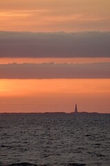 Lighthouse on the isles of Grip at sunset outside the port of Kristiansund, Norway