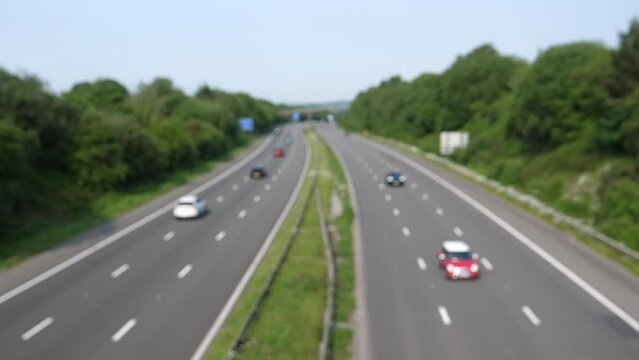 Blurred high angle view of motorway M4 in South Wales, UK. Bridge viewpoint towards West.