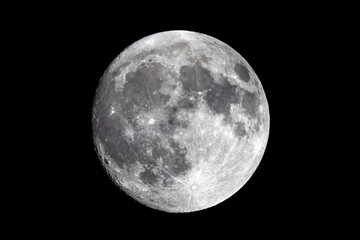 full moon against black sky showing darker clouds around it than seen on screen