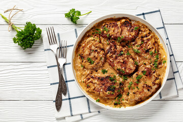 creamy smothered pork chops cooked in onion gravy