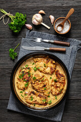 creamy smothered pork chops cooked in onion gravy