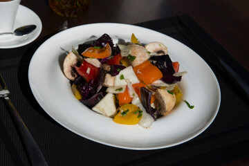 Plate of vegetables served with a cup of coffee