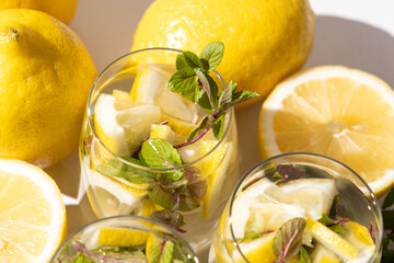 A glass of refreshing lemon water with mint