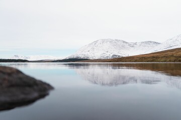 A view from across a body of water, mountains in the background