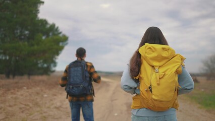 man and woman traveling. active tourism and travel around the world concept. two tourists, man and...