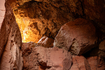 Rocky cave covered in soil and stones
