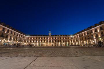 Panoramic view of the main square of ocana and the town hall at dusk with the houses illuminated.