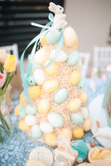 Vertical shot of an easter egg tower as festive decor