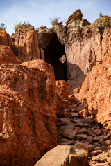 Fototapeta premium the trail is very narrow, though a stone tunnel is in the background