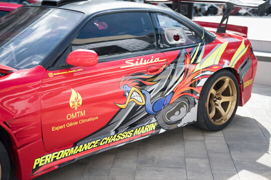 Beautiful Japanese-style livery on the side of the classic sports car Nissan SIlvia S15