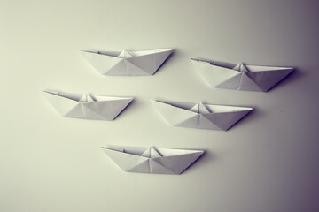 paper boats on the white