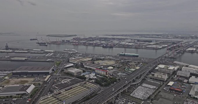 Nagoya Japan Aerial v9 high flyover and around Kinjofuto, Tobishima capturing bridges spanning across the waterway, port harbor and industrial landscape - Shot with Mavic 3 Pro Cine - October 2023