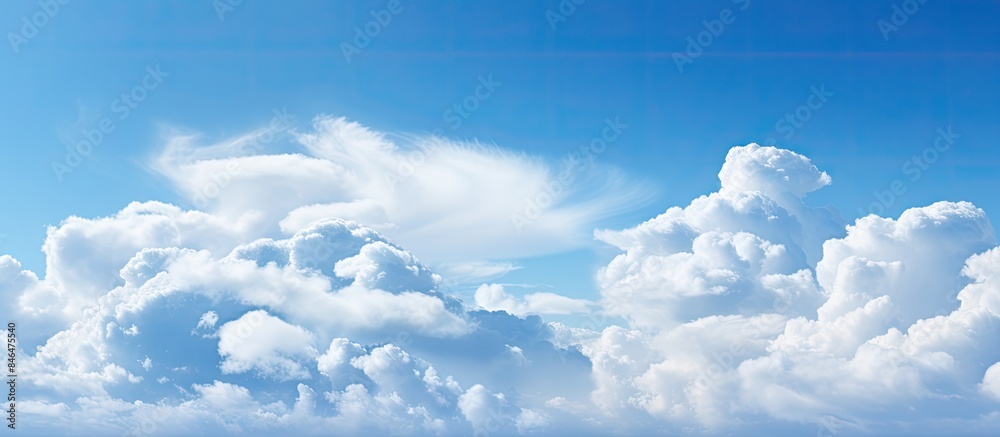 Poster the clear blue sky with fluffy clouds provides ample room for adding text or images
