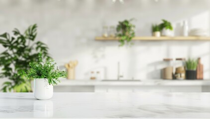 Blurred white kitchen interior with marble countertop and potted green plant on the table in front view.