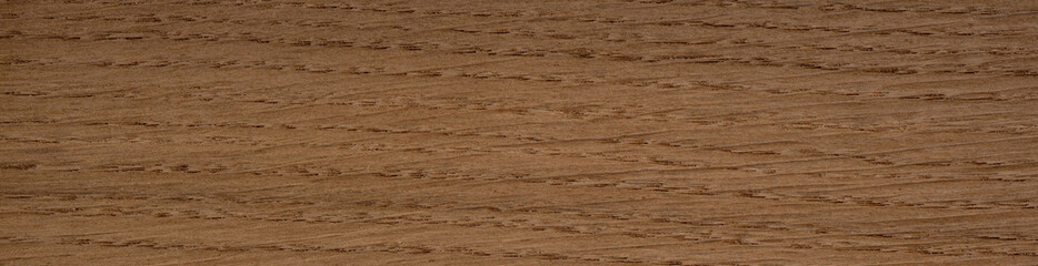 Warm antique oak veneer showcasing natural straight grain and golden tones