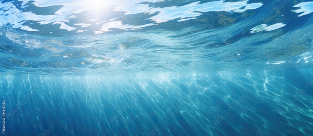 Leinwandbilder the transparent blue water has a sun glare creating a captivating wave texture background perfect fo