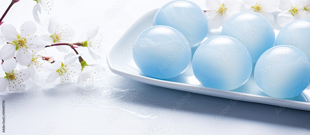 Poster tray of blue easter eggs transformed into dyed eggs with a light blue marble effect placed on a whit