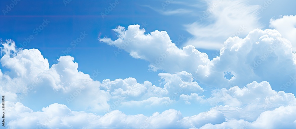 Poster The image features a captivating abstract background of blue sky and clouds providing ample space for additional content