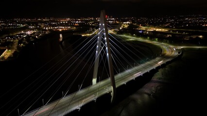 the city lights and traffic on the bridge in an aerial view