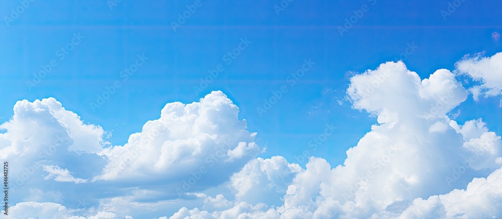 Poster copy space image of a background featuring blue sky and clouds