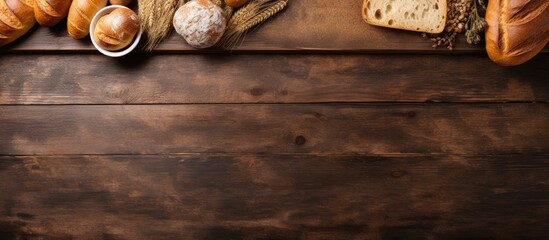 Top down view of a wooden table adorned with freshly baked bread Ample copy space is available for your text
