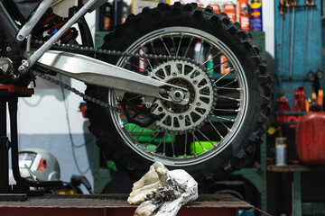motorcycle repair. closeup wheel balancing machine at tyre service center with soft-focus