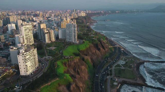 Magic of Lima's Miraflores coast at sunset on a cloudy December day through stunning aerial views.
