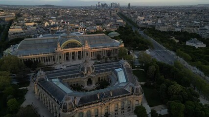 Drone shot of the Petit Palais and the Grand Palais des Champs-Elysees at sunrise in Paris, France
