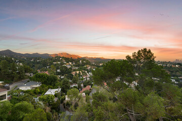 Fototapeta premium View of houses and hills at sunset. Los Angeles, California