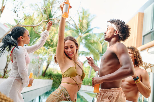 fun woman dancing summer man party young friendship vacation pool friend happy celebration group smiling joy music swimwear gir