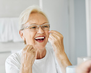 woman tooth bathroom hygiene senior morning routine floss dental care oral mouth product white thread brushing elderly home retirement mirror health cleaning