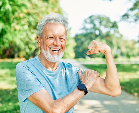 man muscle strength bicep  fitness senior strong arm muscular power training fit mature healthy body exercise confident macho motivation fun flexing