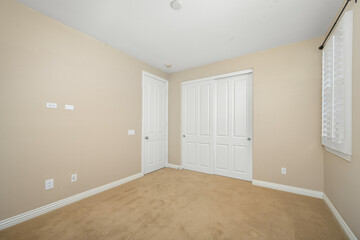Obraz premium Empty room with tan walls and white doors. California, USA