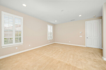 Obraz premium Empty room with tan walls and windows. California, USA