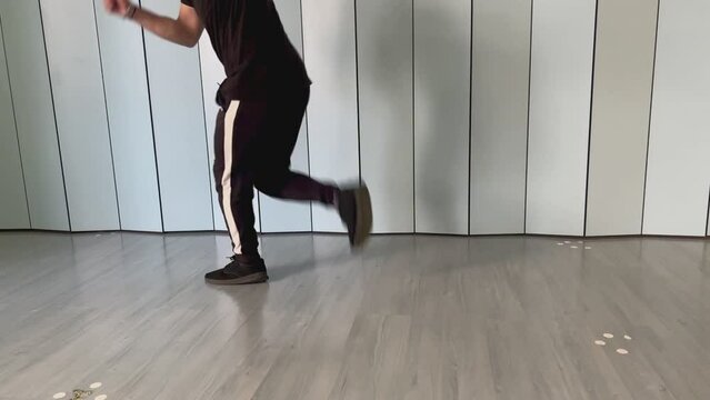 video of a man dancing jumpstyle on the spot