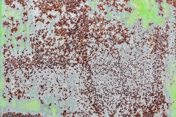 background texture pattern of old rusty iron wall with green paint