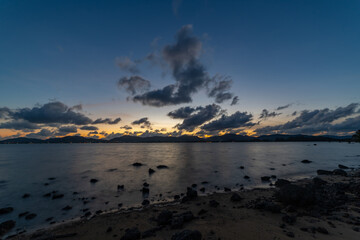 Timelapse clouds in sunset or sunrise sky flowing in the dark sky background
