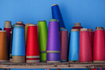 colorful sewing threads ready to be used for sewing clothes