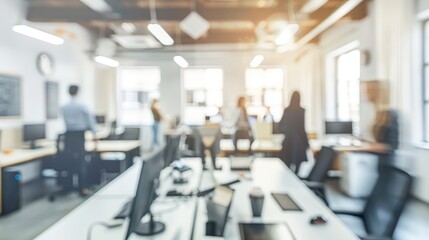 Fototapeta premium Bright open-plan office with soft lighting, blurred background of people working and discussing in contemporary setting.