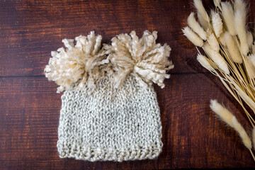 hand made knitted baby hat with pompoms - hand knitting 