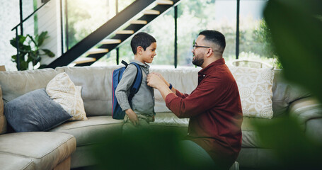 Father, child and son with backpack in living room for preparation, getting ready or back to school. Family, support and happy kid with dad for morning routine, education development or love in home