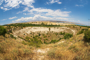 The pit called Kup, which is said to have been formed as a result of a meteorite fall, is a karstic...