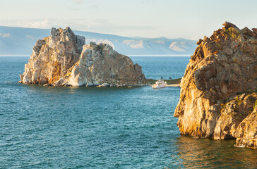 Fototapeta premium Baikal Lake in summer. Tourists sailed by ship to Olkhon Island along the Small Sea to the famous Shamanka Rock on a sunny August day. Summer outdoor recreation and water travel