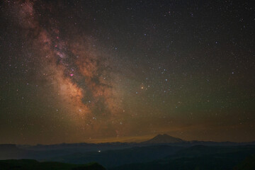 Fototapeta premium Milky way galaxy over the Elbrus mountain